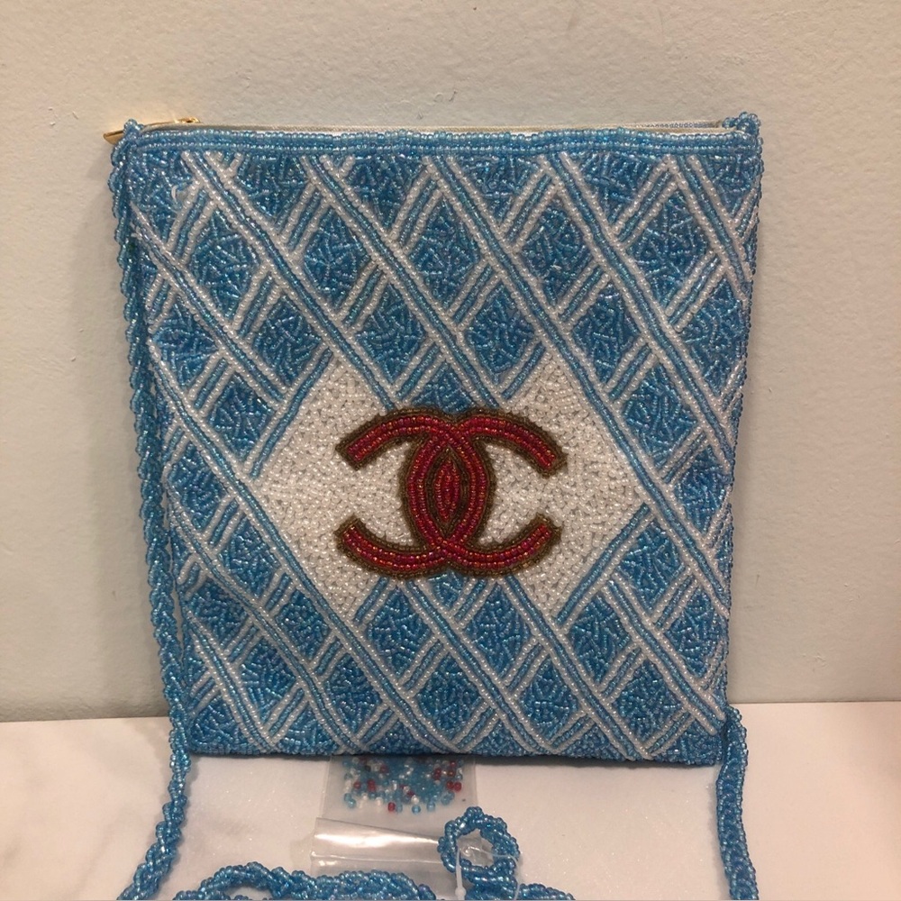 Blue Beaded Crossbody Bag with Red Logo Accent